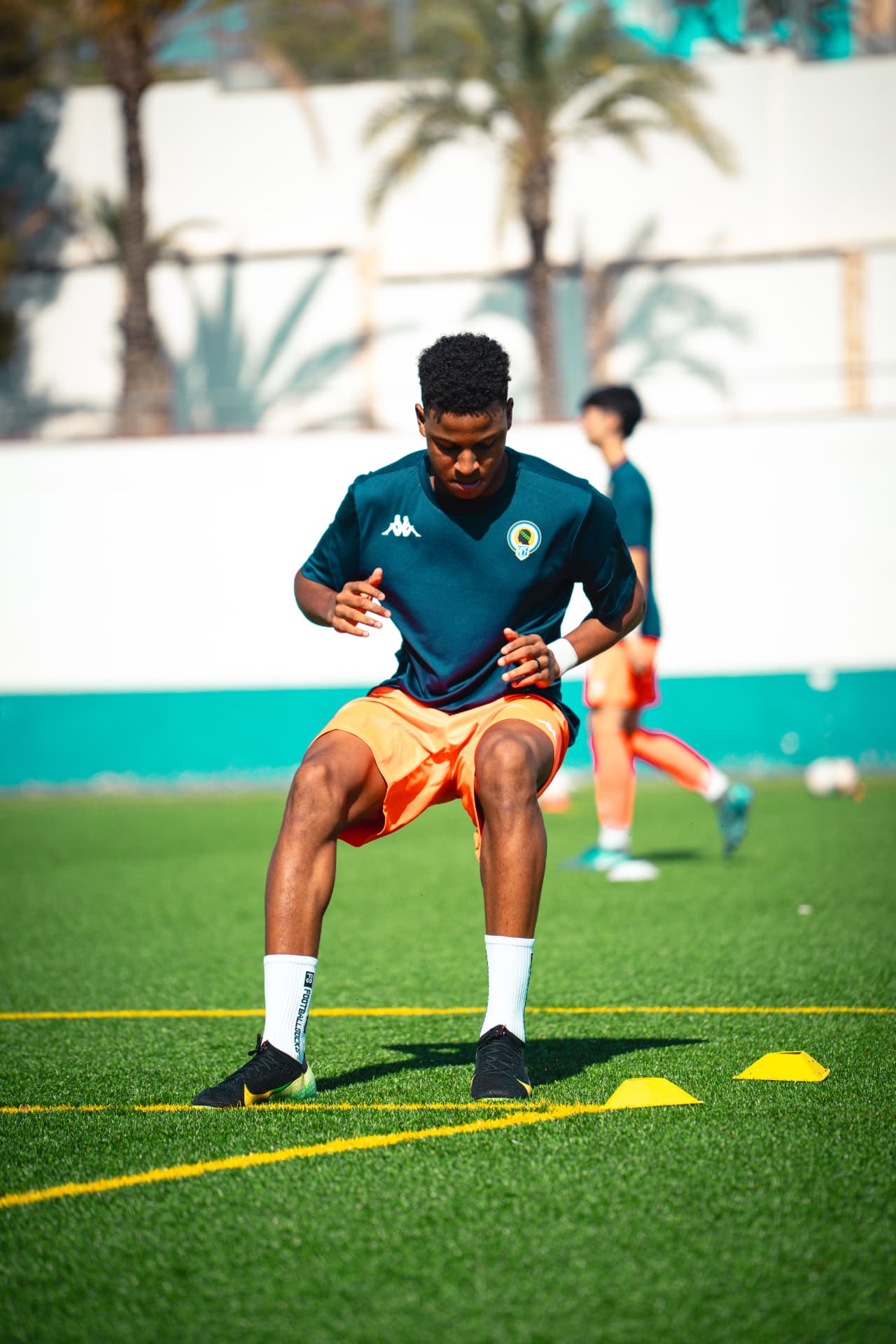 Player working through footwork and agility drills over cones