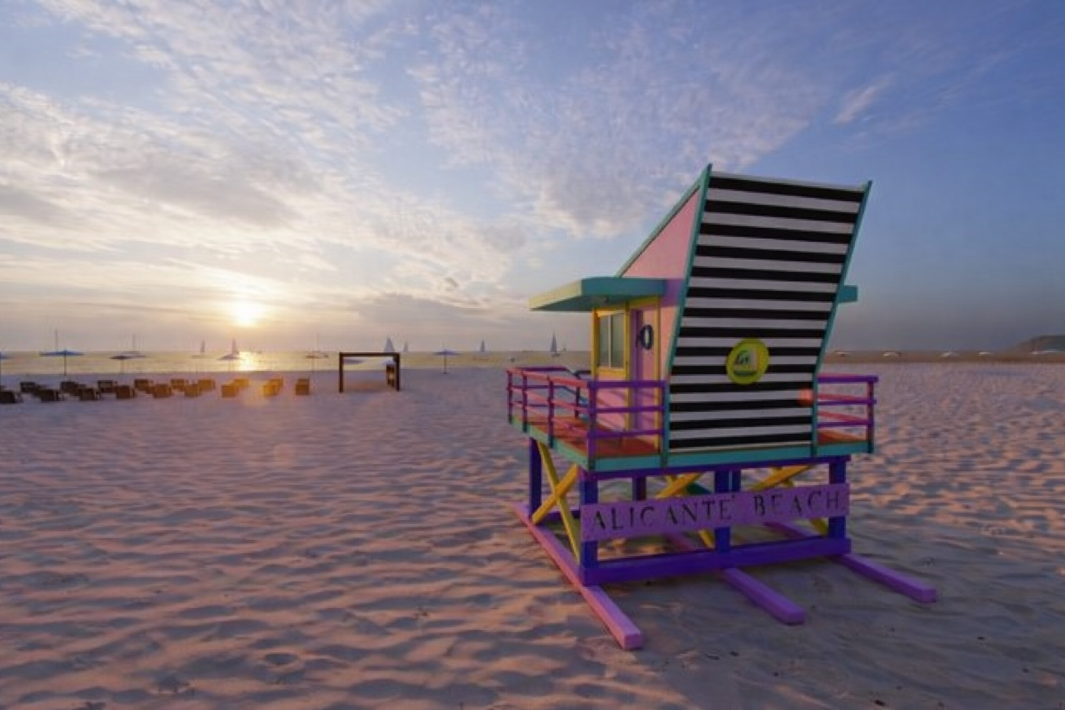 Colourful lifeguard hut at sunset on Alicante beach
