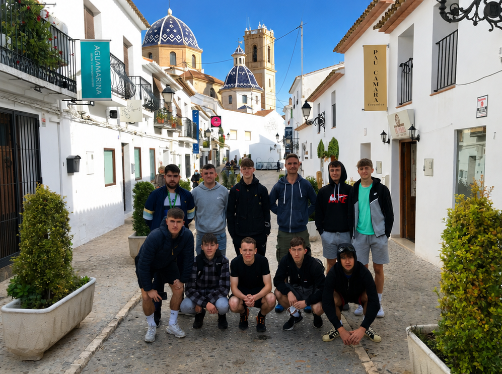 College group exploring the cobbled streets and blue-domed church of Altea