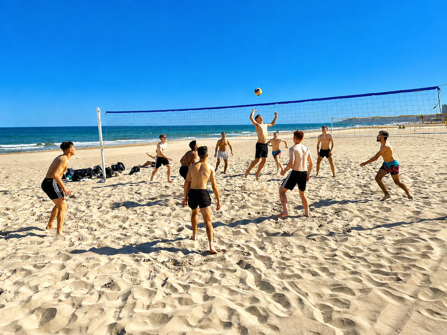 Students playing beach volleyball on San Juan Playa